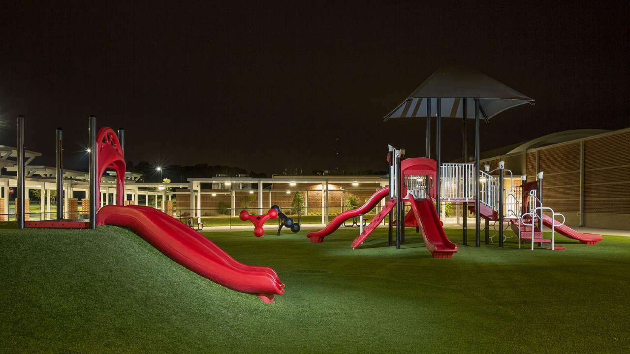 Nighttime artificial turf playground by Southwest Greens Pittsburgh